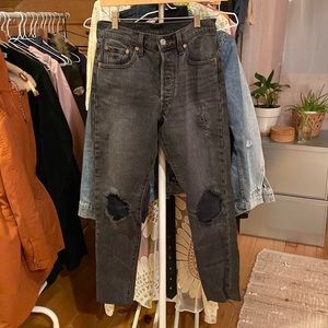 Levi’s 501 distressed black jeans.